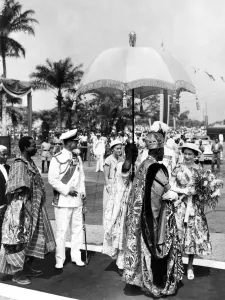Queen Elizabeth II and Prince Philip bid farewell to the Oba (or King) Adenji-Adele II