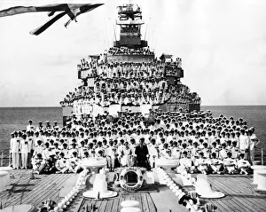 Queen Elizabeth II and Prince Philip pictured with the ships company on the HMAS