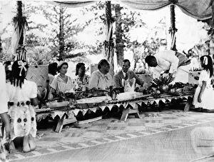 Queen Elizabeth II and Prince Philip with the Queen of Tonga at a feast at which a