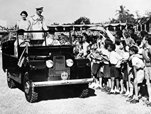 Commonwealth Prints: Queen Elizabeth II and Prince Philip smile at waving schoolchildren during heir visit to