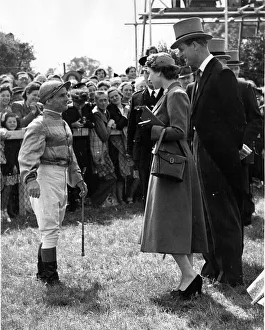 Queen Elizabeth II and Prince Philip talking with champion jockey, Gordon Richards