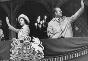 01414 Collection: Queen Elizabeth II and Prince Philip wave to the crowds from a balcony at Durham Town