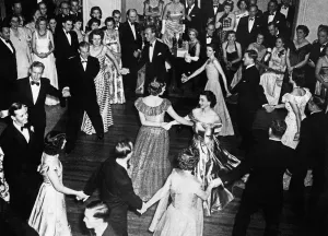 Queen Elizabeth II, Princess Elizabeth dances arms linked with Lady Pamela Mountbatten