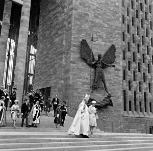 Queen Elizabeth II and Princess Margaret attend the consecration of the new Coventry