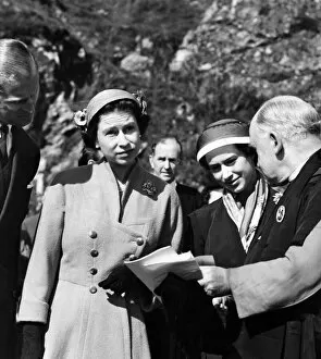 Queen Elizabeth II and Princess Margaret chat with Dr. Charles Ware at Iona Cathedral