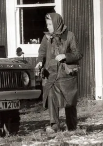 Head Scarf Prints: Queen Elizabeth II at Sandringham in Norfolk Outdoor clothing holding cloth