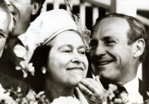 Silly Prints: Queen Elizabeth II scratching her chin smiling at Melbourne racecourse Face looking