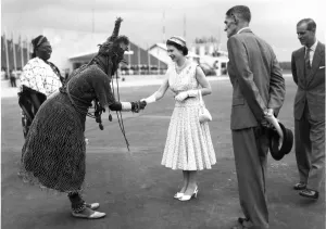Queen Elizabeth II shaking hands with a Nigerian chief during a visit to the country