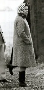 Head Scarf Prints: Queen Elizabeth II standing on one leg looking silly wearing wellies June 1980