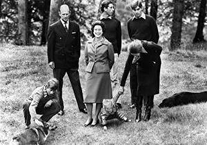 Queen Elizabeth II takes a stroll in the grounds of Balmoral Castle with Prince Philip