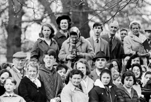 Queen Elizabeth II taking pictures on her Roliflex camera at Badminton Horse Trials with