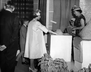 Queen Elizabeth II visiting Wales. The Queen takes an interest in some of the quilts