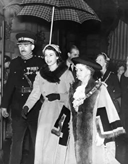 Queen Elizabeth II visits Sunderland with Mayor Jane Huggins sheltering from the rain