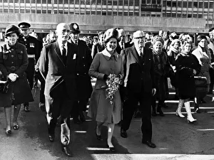 Queen Elizabeth II walks to Cardigan House from the hospital with Dr J. P