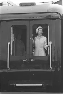 Queen Elizabeth looks out of the Royal Train after arriving in Wales the Investature of