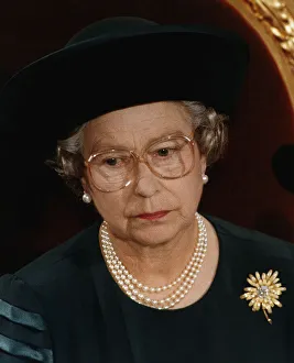 Unhappy Prints: Queen Elizabeth wearing glasses Recent family problems take their toll on her