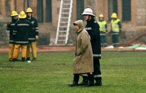 The Queen is escorted by the chief fire officer around the grounds of Windsor Castle as