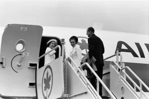 The Queen, followed by Princess Anne and The Duke of Edinburgh boarding the plane for a