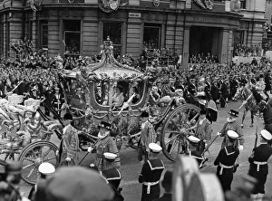 The Queen in the Gold State Coach passing Charring Cross Road