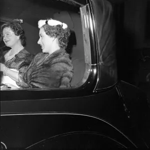 Fur Wrap Prints: The Queen Mother and Princess Margaret seen here leaving the Salon of clothes designer