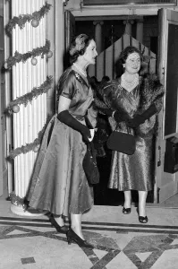 The Queen Mother seen here at the Salon of clothes designer Hardy Amies following a