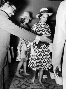 Customs Prints: The Queen and Princess Anne walk barefoot through a Mosque in Kuala Lumpur