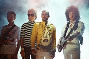 Queen rock group performing. Singer Freddie Mercury with guitarist Brian May