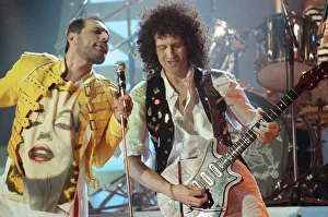 Queen rock group performing. Singer Freddie Mercury with guitarist Brian May