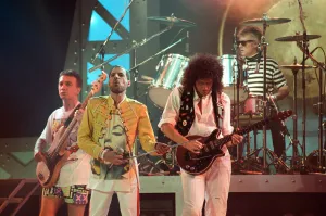 Queen rock group performing. Singer Freddie Mercury with guitarist Brian May