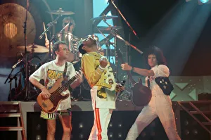 Queen rock group performing. Singer Freddie Mercury with guitarist Brian May