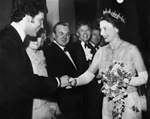 Pop Music Prints: The Queen shaking hands with Tom Jones at the Royal Variety Show at the London Palladium