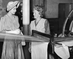 The Queen visits Manchester, Mrs Shirley (45 years servive) and Queen Elizabeth at mill
