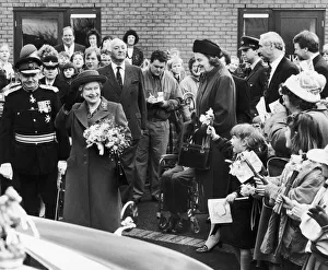 00379 Prints: The Queen visits Manchester. Pictured here she waves to the crowd on her visit to