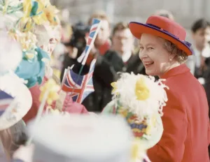 Queen Visits Manchester, the Queen receives flowers when she walks around on her visit to