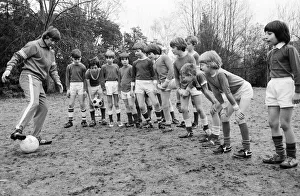Queens Park Rangers footballer Don Masson coaching children to play football at the Our