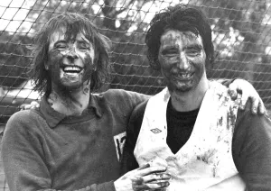 00186 Prints: Queens Park Rangers stars Stan Bowles (left) and Dave Clement enjoying a mud-lark