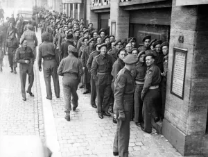 Belgium Prints: A queue of soldiers waiting to buy Christmas presents for home at a Brussels store