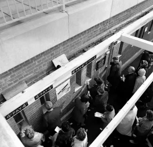 Racecourse Prints: Queues of people waiting to place bets at the tote before a race October 1969