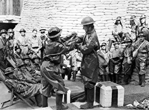 01441 Prints: How to quickly dress in gas clothes. Women demonstrate at a first aid post in Hendon