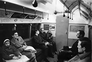 00250 Prints: The quiet man holding a parcel on the tube train went unnoticed