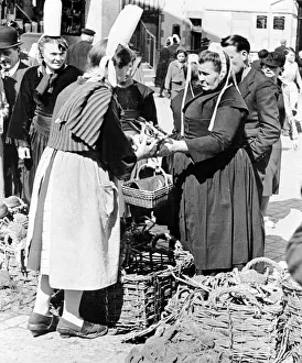National Dress Prints: Quimper Britanny France A fishwife sells crabs at a market at Quimper in South