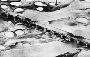 01473 Prints: R. A. F. Kittyhawks attack railway bridge at Fano during the Second World War