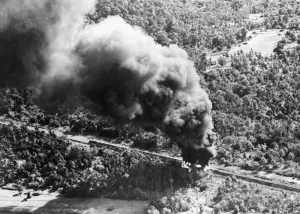 Heavy Prints: R. A. F Liberators bomb a Japanese train 15 miles south of Anim