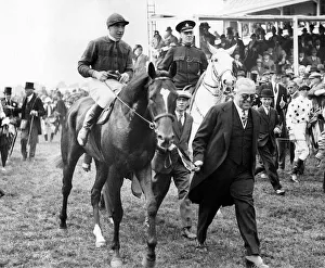 Racehorse Blenheim with jockey Harry Wragg jockey is led by owner the Aga Khan after his