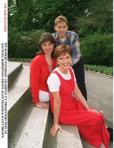 Rachael Robertson TV Presenter with Kate Fraser and Scott Brown sitting on concrete steps