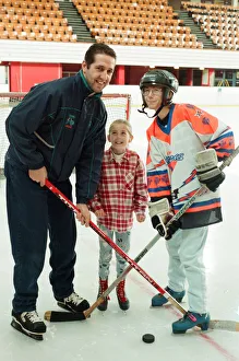 Rachel Toth watches as her mam Mary and Sheffield Steelers Ice Hockey player Andre Malo