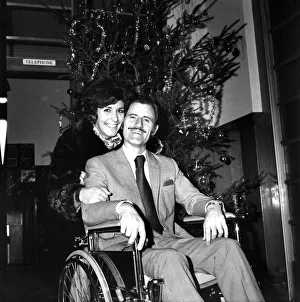 Wheelchair Prints: Racing driver Graham Hill left University College Hospital, in a wheelchair