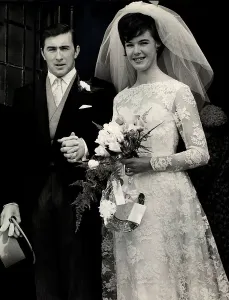Racing driver Jackie Stewart with his bride Helen McGregor after their wedding ceremony