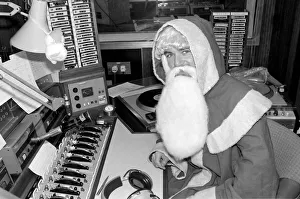 Radio One Disc Jockey Noel Edmonds dressed as Father Christmas on his breakfast show