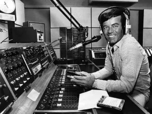 Radio One disc jockey Tony Blackburn behind the record decks spinning the discs for